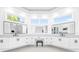 Bright bathroom boasting dual vanities, ample storage, and contemporary fixtures at 15749 Acorn Cir, Tavares, FL 32778