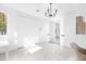Spacious bedroom featuring large closet, modern light fixture, and a neutral color palette at 15749 Acorn Cir, Tavares, FL 32778
