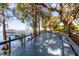 Expansive deck with waterfront views and ample seating at 15749 Acorn Cir, Tavares, FL 32778