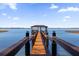 Picturesque dock featuring a covered gazebo with panoramic lake views at 15749 Acorn Cir, Tavares, FL 32778