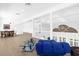 Bright living room with open floor plan and view of dining area at 15749 Acorn Cir, Tavares, FL 32778