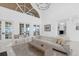 Bright living room features high ceilings, modern decor, and an open layout, perfect for entertaining at 15749 Acorn Cir, Tavares, FL 32778