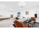 Spacious main bedroom suite featuring water views, sitting area, and modern furnishings at 15749 Acorn Cir, Tavares, FL 32778