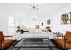 Spacious main bedroom suite featuring water views, sitting area, and modern furnishings at 15749 Acorn Cir, Tavares, FL 32778