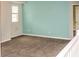 The room features a window, carpet, and light blue walls at 2572 Limerick Cir, Grand Island, FL 32735