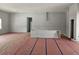 Spacious living room with base flooring protection, perfect for customization at 40327 Royal Trails Rd, Eustis, FL 32736