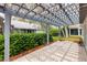 Covered patio offers outdoor living space overlooking landscaped backyard at 206 Desota Ct, The Villages, FL 32159