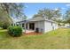 Backyard patio area is surrounded by green space, offering a private retreat at 206 Desota Ct, The Villages, FL 32159