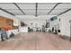 Spacious garage with ample storage and organizational features at 206 Desota Ct, The Villages, FL 32159