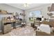 Home office with built-in shelves, a large window, and comfortable seating at 206 Desota Ct, The Villages, FL 32159