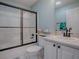 Bathroom featuring a shower, toilet and a sink at 3360 Richmond Dr, The Villages, FL 32162
