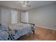 A bedroom with a bed, ceiling fan and hardwood floors at 3360 Richmond Dr, The Villages, FL 32162