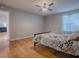 Bedroom with hardwood flooring, ceiling fan, and natural light at 3360 Richmond Dr, The Villages, FL 32162