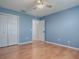 Bedroom with hardwood flooring and spacious closet at 3360 Richmond Dr, The Villages, FL 32162
