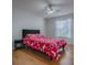 Cozy bedroom with hardwood floors and a ceiling fan at 3360 Richmond Dr, The Villages, FL 32162