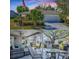 Charming single-story home with well-manicured lawn, complemented by a screened patio and outdoor furniture at 3360 Richmond Dr, The Villages, FL 32162