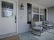 Cozy front porch with seating, perfect for enjoying the neighborhood at 3360 Richmond Dr, The Villages, FL 32162