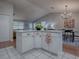 Kitchen island offers additional counter space and seating, connecting to dining and living areas at 3360 Richmond Dr, The Villages, FL 32162