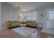 Bright living room featuring hardwood floors, neutral paint and large windows at 3360 Richmond Dr, The Villages, FL 32162