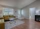 Bright living room with hardwood floors and neutral paint tones at 3360 Richmond Dr, The Villages, FL 32162