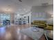 Open living area featuring wood floors, lots of seating, and natural light at 3360 Richmond Dr, The Villages, FL 32162