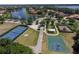 Community park featuring a tennis court, basketball court, playground, and a tranquil lake with fountain at 5441 Sea Leopard St, Tavares, FL 32778