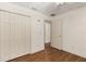 A simplistic bedroom design with hardwood flooring and closet storage at 5441 Sea Leopard St, Tavares, FL 32778
