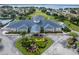 Aerial view of the community center with tropical landscaping and covered entrance at 5441 Sea Leopard St, Tavares, FL 32778