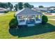 Charming gazebo with picnic tables, surrounded by manicured lawns and landscaping, perfect for outdoor gatherings at 5441 Sea Leopard St, Tavares, FL 32778