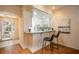 Open kitchen with a breakfast bar and bright lighting at 5441 Sea Leopard St, Tavares, FL 32778