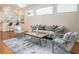 Stylish living room features a neutral color scheme, hardwood floors, and ample natural light at 5441 Sea Leopard St, Tavares, FL 32778