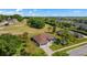 Beautiful aerial view of a well-situated home near the golf course and lush green surroundings at 8925 Pebble Beach Pl, Clermont, FL 34711