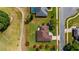 Aerial view showcases the property, its neatly kept lawn, and its proximity to the golf course at 8925 Pebble Beach Pl, Clermont, FL 34711