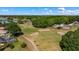 Scenic aerial shot of the community golf course, illustrating the tranquil lifestyle offered to residents at 8925 Pebble Beach Pl, Clermont, FL 34711