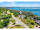 Beautiful lakefront estate surrounded by mature trees offers privacy and gorgeous water views at 10417 Lake Louisa Rd, Clermont, FL 34711