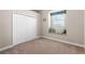 Cozy bedroom featuring a window seat and a built-in closet at 10417 Lake Louisa Rd, Clermont, FL 34711