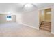 Large bonus room featuring ceiling fans and staircase at 10417 Lake Louisa Rd, Clermont, FL 34711