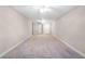 Spacious bonus room featuring two entry doors and ceiling fans at 10417 Lake Louisa Rd, Clermont, FL 34711
