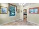 Bright dining area with tile floors, large windows, and views into an adjacent kitchen at 10417 Lake Louisa Rd, Clermont, FL 34711