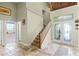 Spacious foyer with tile flooring and an elegant front entrance at 10417 Lake Louisa Rd, Clermont, FL 34711