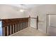 Loft space featuring views of downstairs and a railing at 10417 Lake Louisa Rd, Clermont, FL 34711