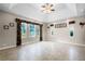 Spacious main bedroom with trey ceiling, transom windows, and decorative window treatments at 10417 Lake Louisa Rd, Clermont, FL 34711