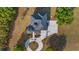 Top-down view of the beautiful roofline and circular driveway of the home with mature landscaping at 10651 Arrowtree Blvd, Clermont, FL 34715