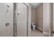 Bathroom with a tiled shower and a separate toilet area at 10651 Arrowtree Blvd, Clermont, FL 34715