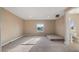 Large bonus room with carpet, windows, and adjacent bathroom at 10651 Arrowtree Blvd, Clermont, FL 34715