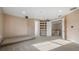 Spacious bonus room with carpet and view of the staircase at 10651 Arrowtree Blvd, Clermont, FL 34715