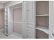Spacious walk-in closet with custom shelving and ample storage at 10651 Arrowtree Blvd, Clermont, FL 34715