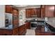 Gorgeous kitchen with stainless appliances, an island and granite countertops at 10651 Arrowtree Blvd, Clermont, FL 34715