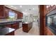 Spacious kitchen with granite countertops, island, and stainless steel appliances at 10651 Arrowtree Blvd, Clermont, FL 34715