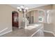 Living room area featuring tile flooring and view of back yard at 10651 Arrowtree Blvd, Clermont, FL 34715